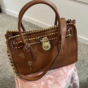 Michael Kors Brown Leather Satchel with Gold Hardware.